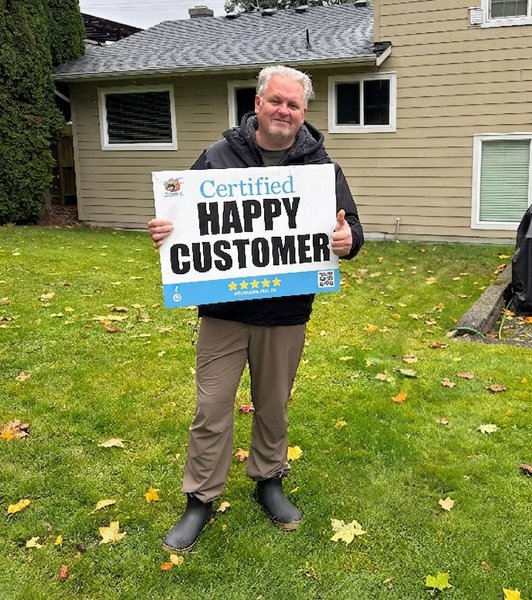 Happy customer after roof moss removal in Cloverdale, Surrey