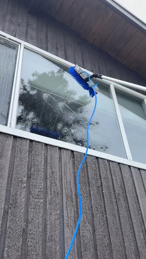 Purified water rinsing down a large picture window after brushing
